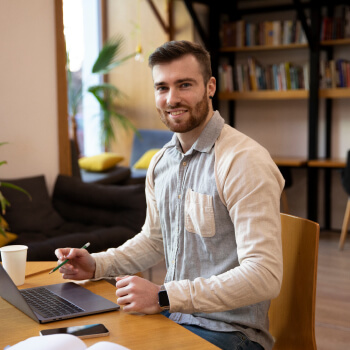 A young guy working on a laptop - Strategic Planning
